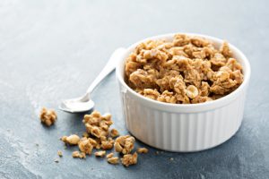 Peanut butter granola in white ramekin